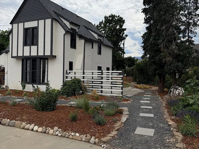 Path from street to back patio and yard