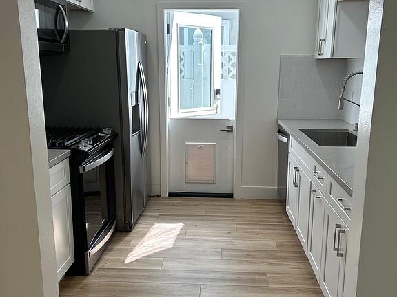 Bright Kitchen with all New appliances and dutch door
