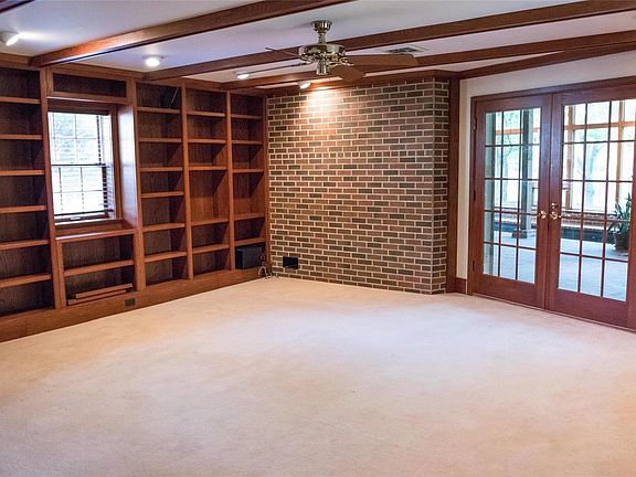 Library/Great Room with Gas Fireplace. Atrium doors leads you to Pool Room