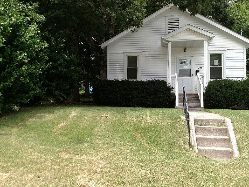 FRONT OF HOME WITH SMALL COVERED PORCH
