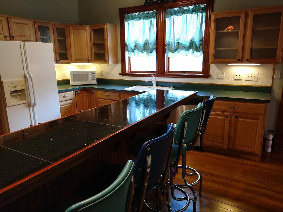 Kitchen with breakfast bar, hickory cabinets and under cabin - 609 Harrison Ave