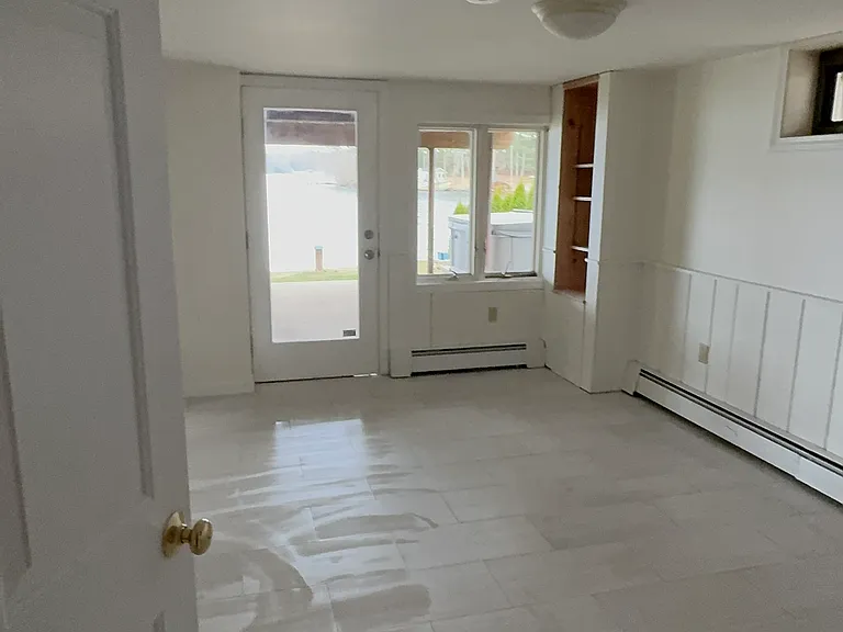 Downstairs walkout. Room has small kitchenette and can be a spare room/office space.