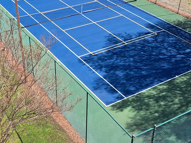 Tennis court/shuffle board in front of building