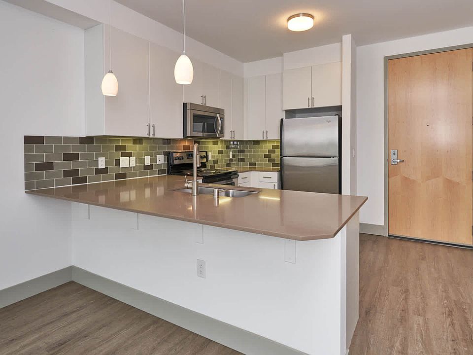 Kitchen with Stainless Steel Appliances and Breakfast Bar