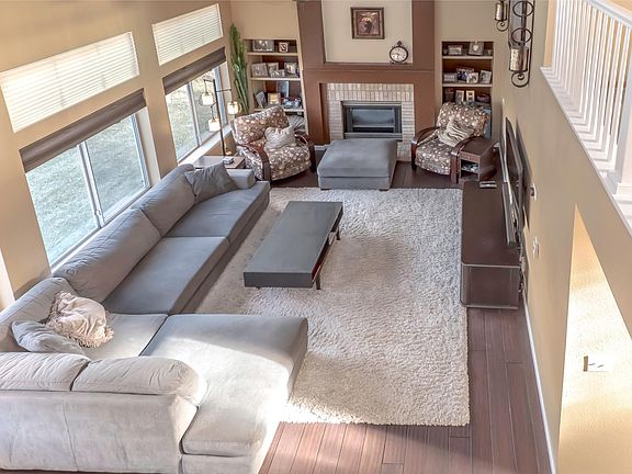 Living Room with vaulted ceilings, opens to kitchen.
