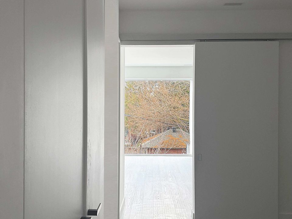 view from bedroom through living drapes open