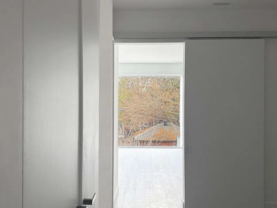 view from bedroom through living drapes open