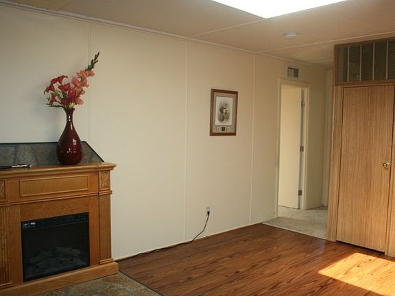 Skylight and electric fireplace add warmth a coziness to your home.