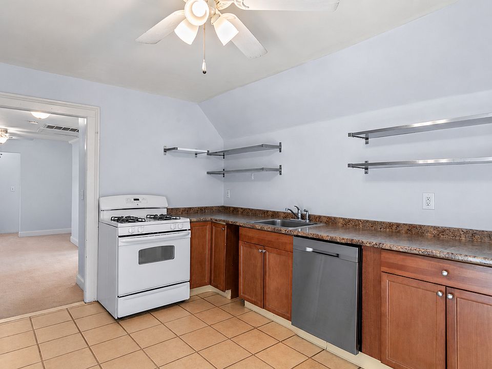 Gas range, ample counter space, storage shelves