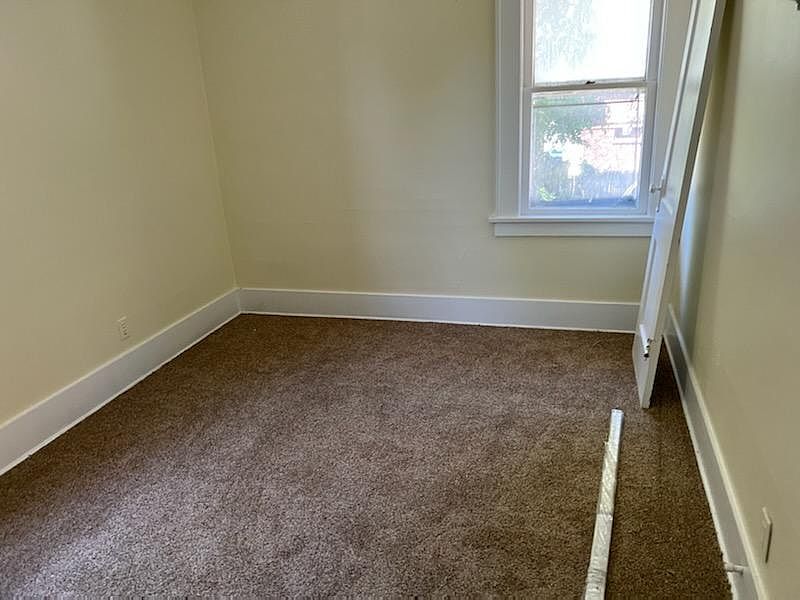 Northwest bedroom with new nylon carpeting, it has two windows