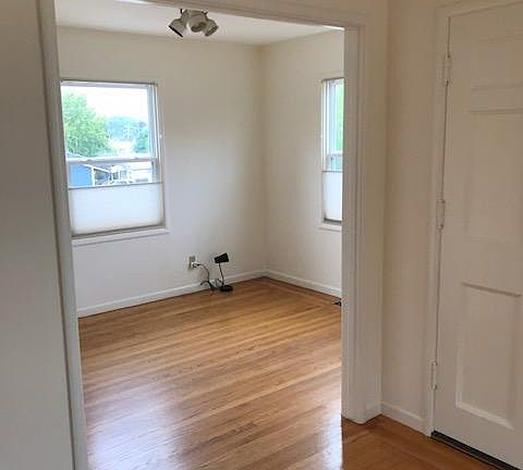 Dining room, viewed from living room. Dining room has a view of Mt. Tamalpais.