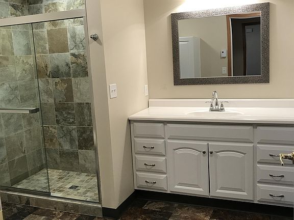 Bathroom with walk-in tiled shower