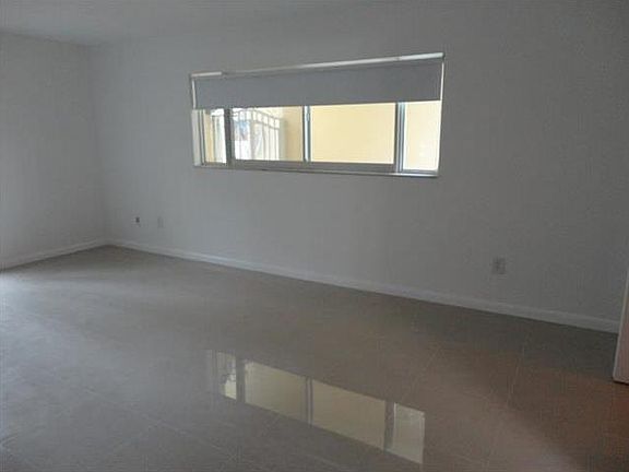 2nd image of 9971 W Bay Harbor Dr APT 107