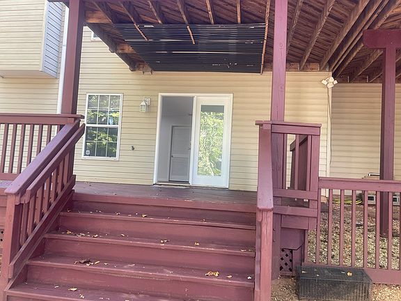Unit entrance and spacious Deck leads to the living room.