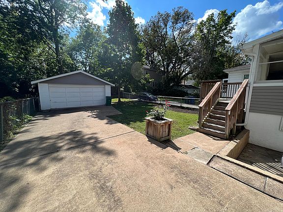 Fully fenced backyard with two car garage