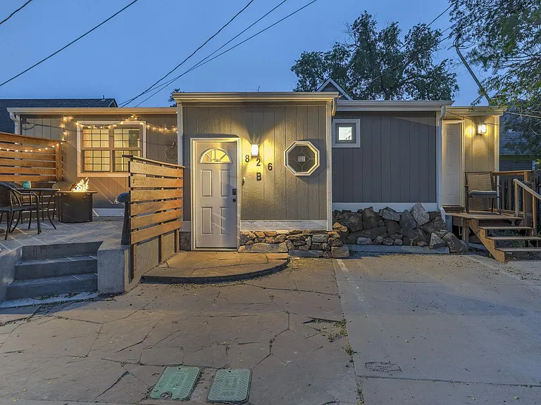 Cute front yard with a fire pit, grill, table and chairs!