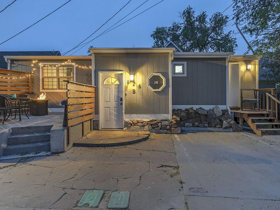 Cute front yard with a fire pit, grill, table and chairs!