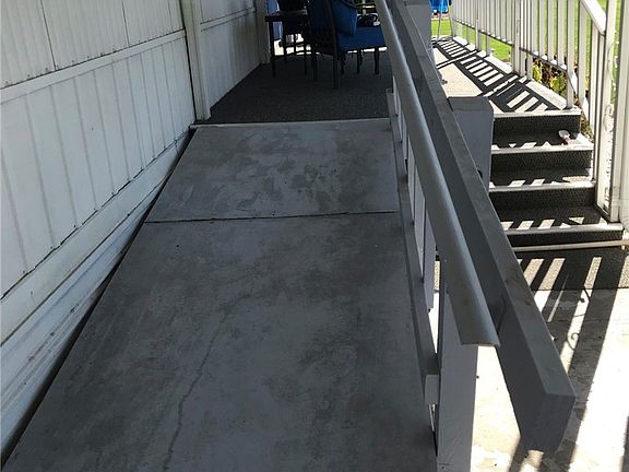 Ramp & stairs to front covered porch.
