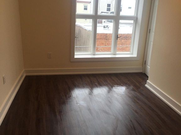 brand new living room with wood floors