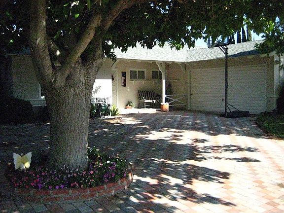 Custom driveway highlighting shade tree!