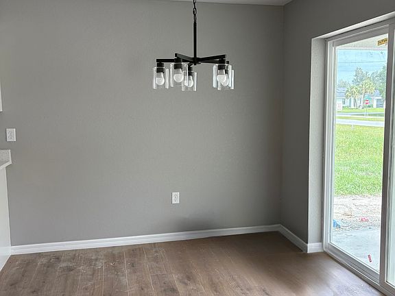 Dining Room with sliding doors that lead out to fenced-in backyard - great for dogs!