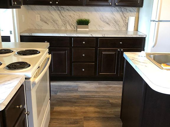 Espresso cabinets in Kitchen and BA_s