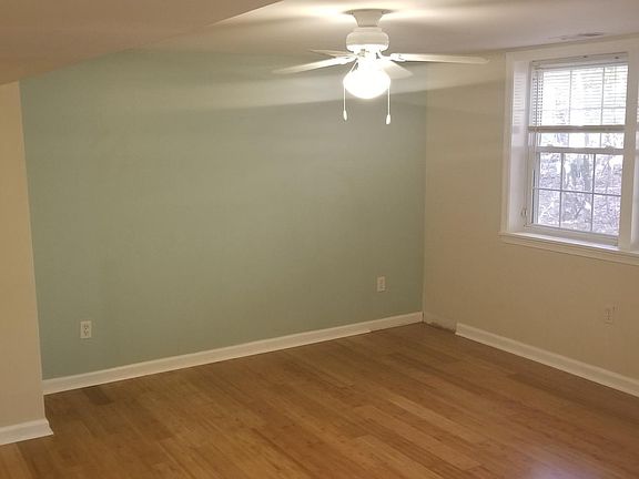 Living room (the walls will be repainted to antique white and the trim will be fixed before move in)