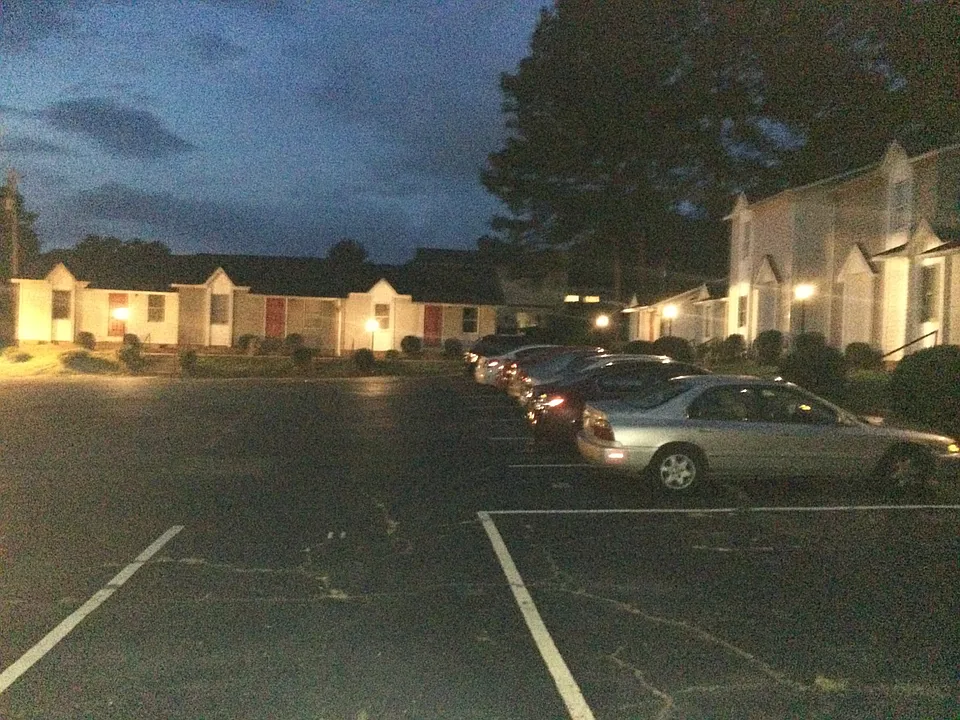 Derby Apartments at night.