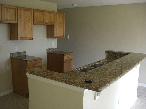 unit comes with fridge, dishwasher, stove, this photo is old before appliances placed