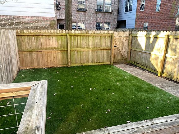 Large backyard for the area perfect for entertaining. No maintenance Astro Turf!