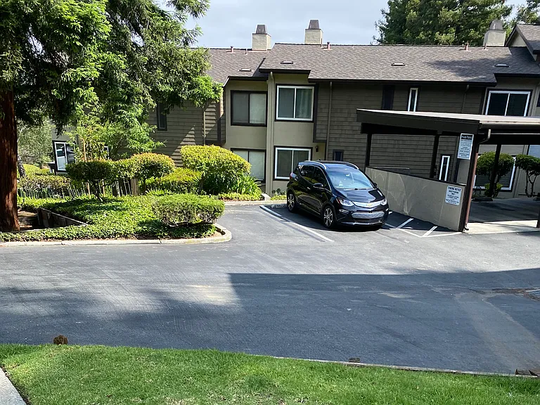 There are 3 uncovered visitor parking spots.