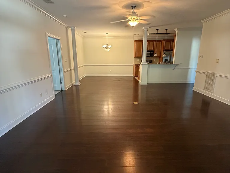 living room area looking into dining area and kitchen with open floor plan
