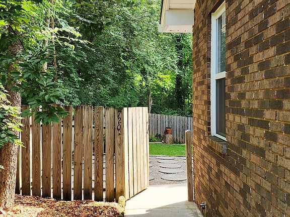 Sidewalk to gate of back unit - fully fenced backyard