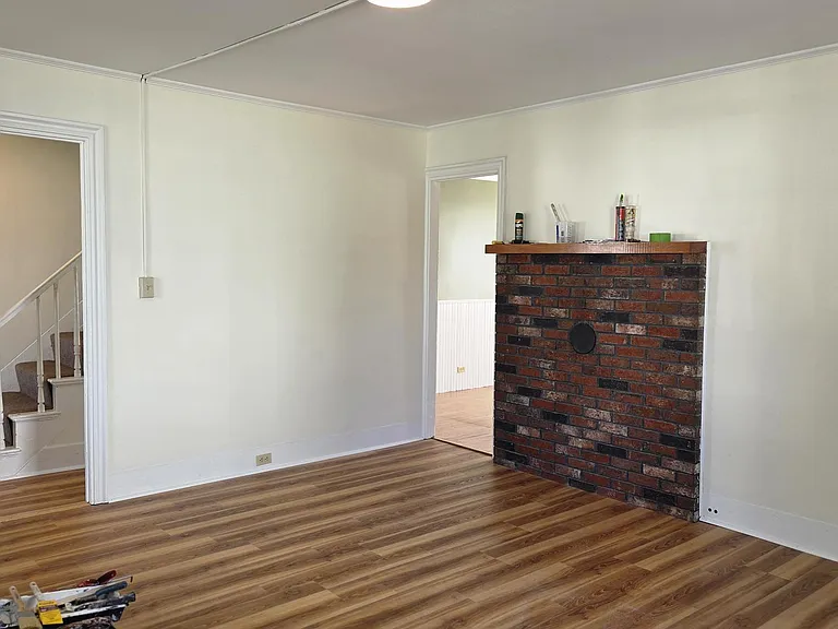 Bright, Sunny Living Area With Fireplace Mantle, Premium Laminate Flooring, Newer Windows