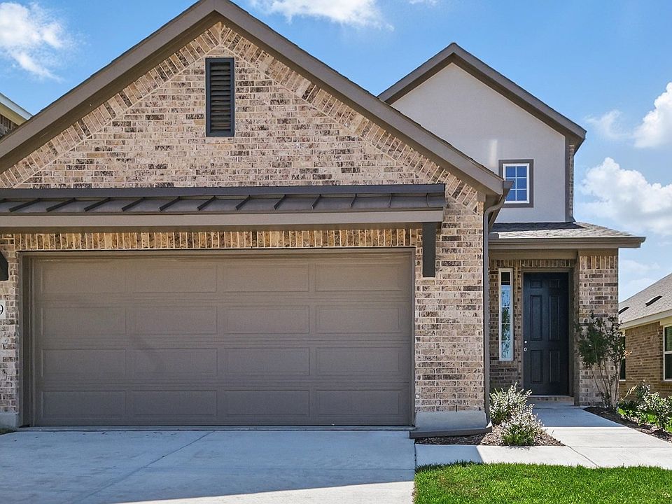 Elegant brick facade with gable roofing exudes sophistication in Latitude at Churchill.