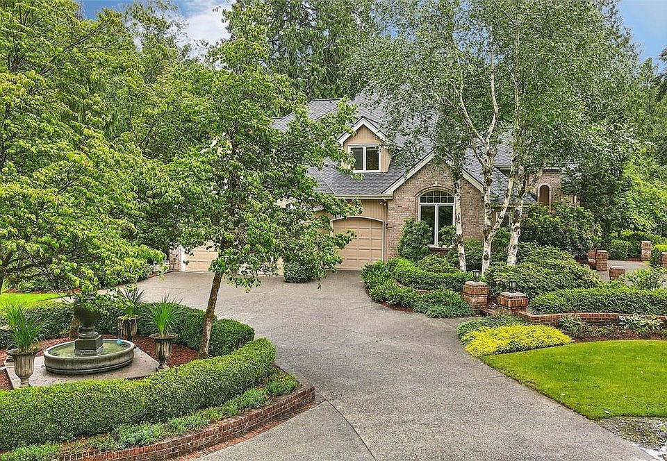Nestled on 2+ Acres, this ultra-private homesite has beautiful gardens and park-like grounds bordering almost 300' of creek waterfront.