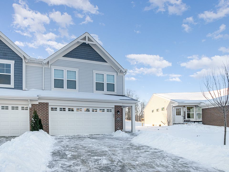 bid driveway and a 2-car garage