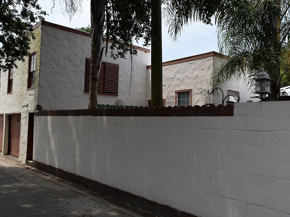 This Townhome features a very secure walled in front courtyard