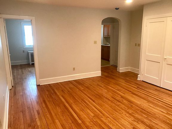 Living Room - Looking at Kitchen and Entrance on Right and Bedroom on Left