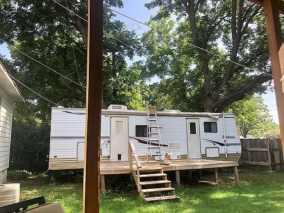 Backyard from porch W/ Pecan