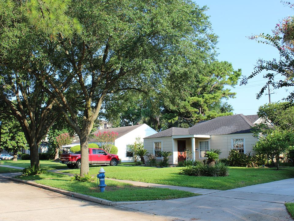 Residence and 2 large shade trees