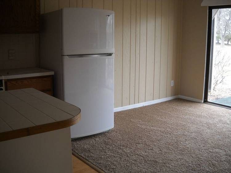 Another view of living room & kitchen.
