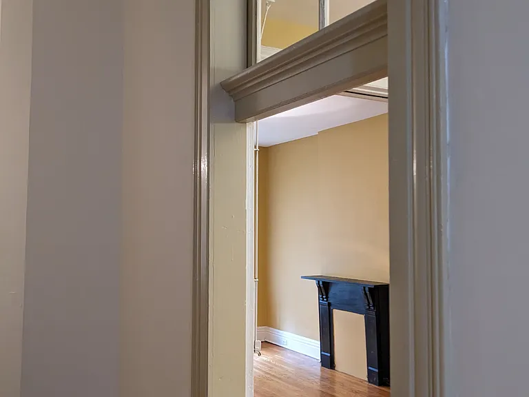 looking into living room from downstairs hallway