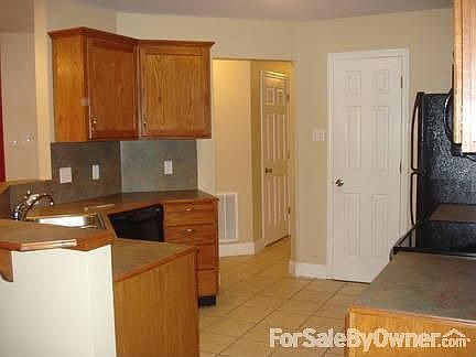 Kitchen : Kitchen overlooks living area - bar seating for two to three.