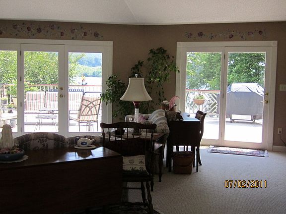 side of great room
						:
						looking out on deck - there is another set of dbl doors left of the triple set