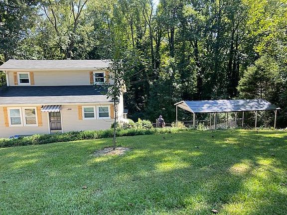 Wahoo House cedar shutters, new awnings, new carport