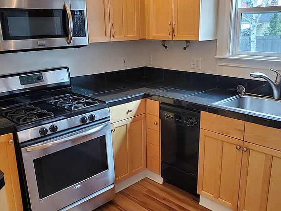 Kitchen with D/W, self cleaning oven, microwave, side by side refreigerator