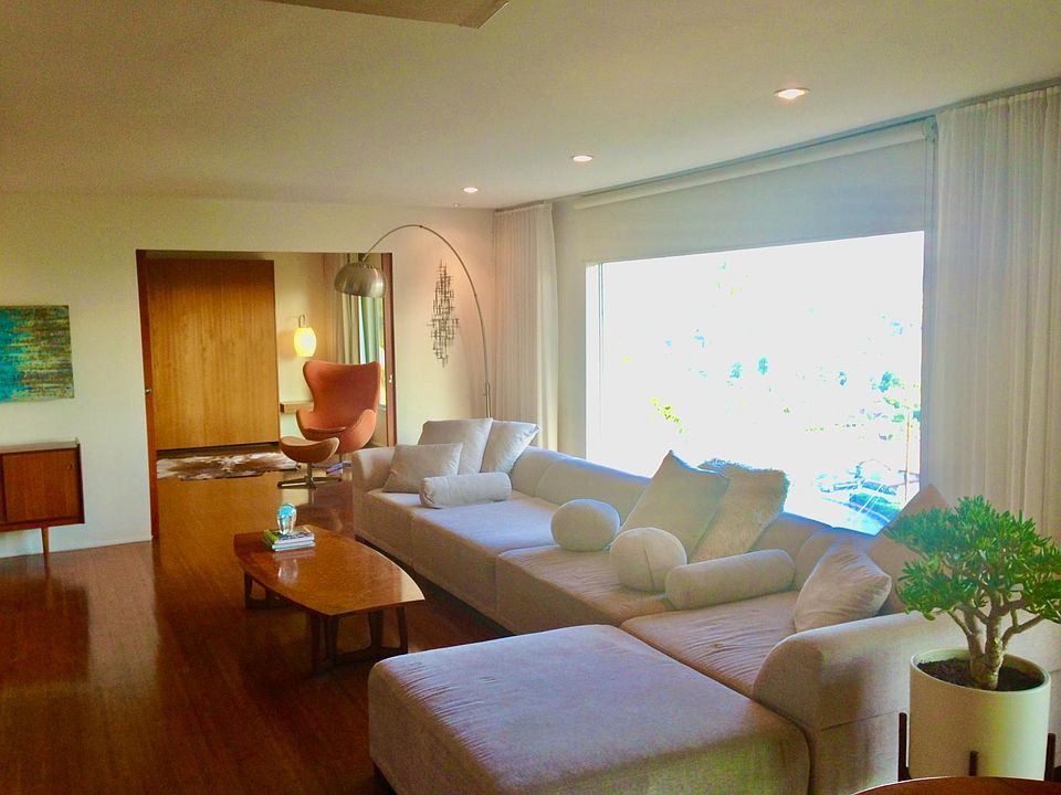 Large Living room with big beautiful windows of the view, Guest room has a built in Murphy bed and sitting area