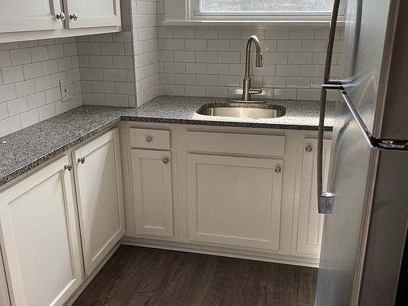 Completely renovated kitchen with granite counter tops and stainless steel appliances