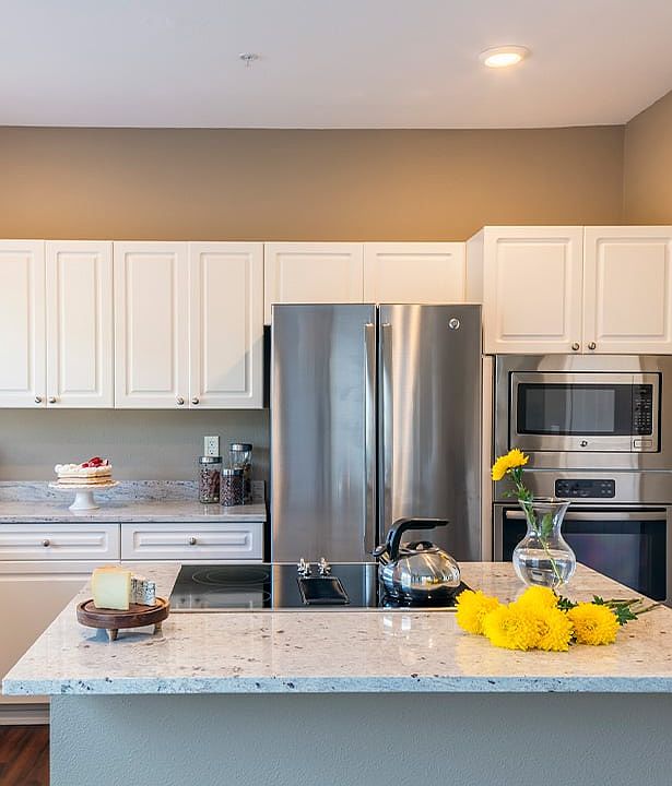 Kitchens feature custom touches like kitchen islands and breakfast bars
